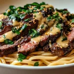 Garlic butter steak lightning noodles with juicy sliced steak, glossy garlic butter sauce, and noodles, topped with parsley and sesame seeds.